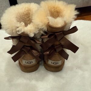 UGG Tan Sheepskin Boots with Brown Bows